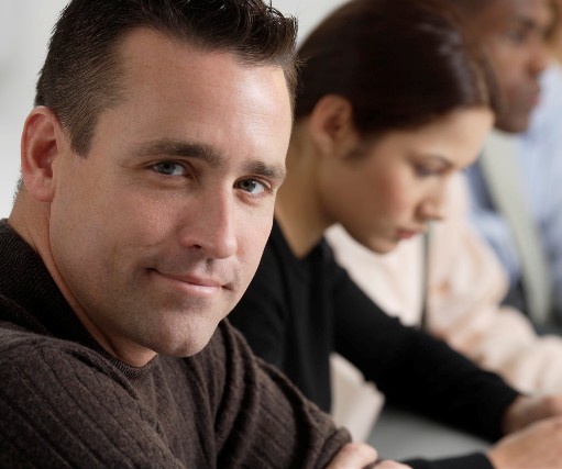 man in brown sweater with ministry teams